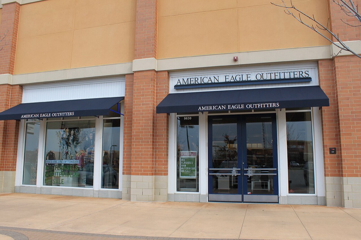 An American Eagle Outfitters storefront with navy awnings at an outdoor shopping center in Michigan