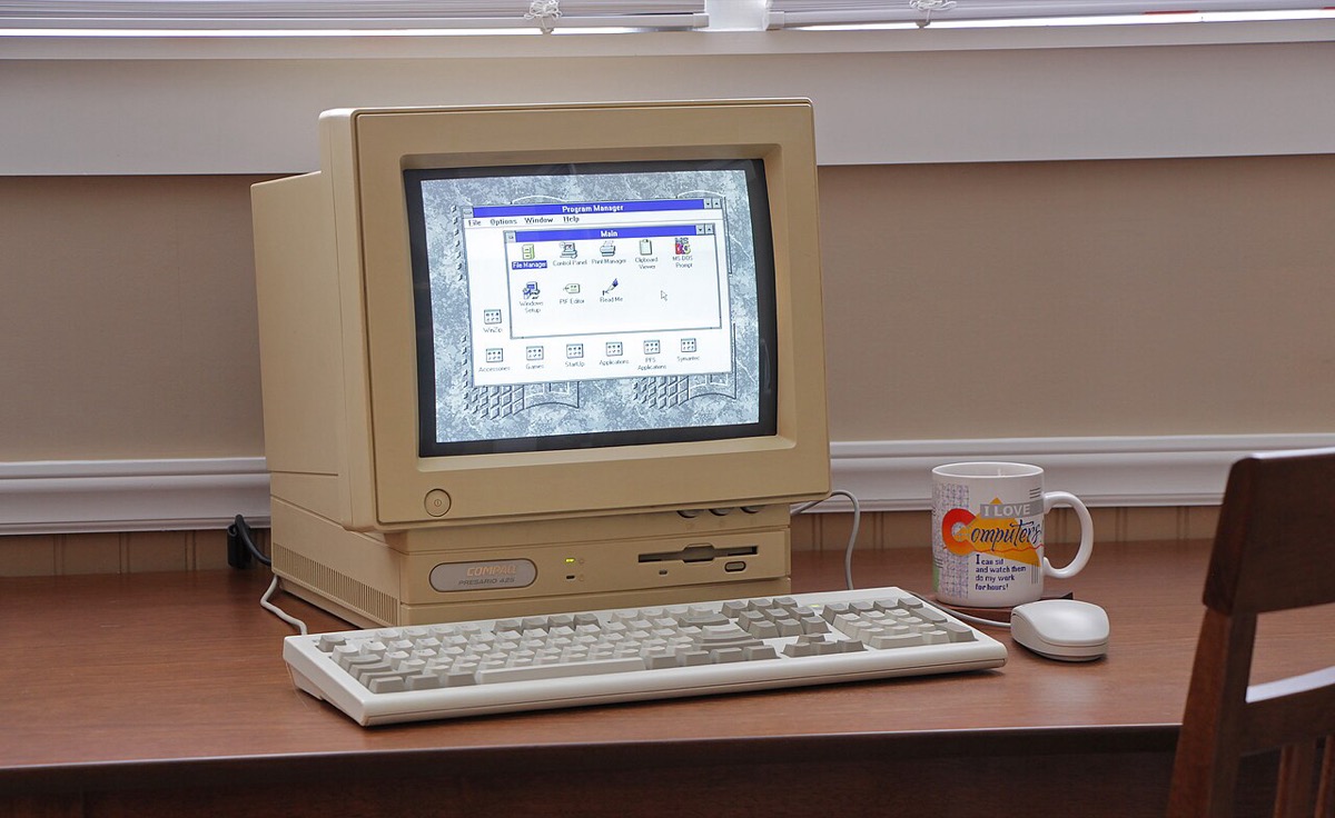 a mid-1990s beige desktop computer — the kind AOL chat rooms were visited on