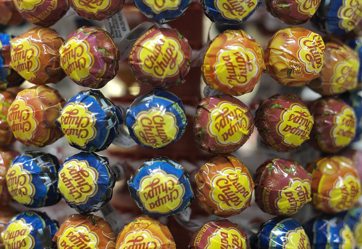 A tightly packed display of wrapped Chupa Chups lollipops showing the logo