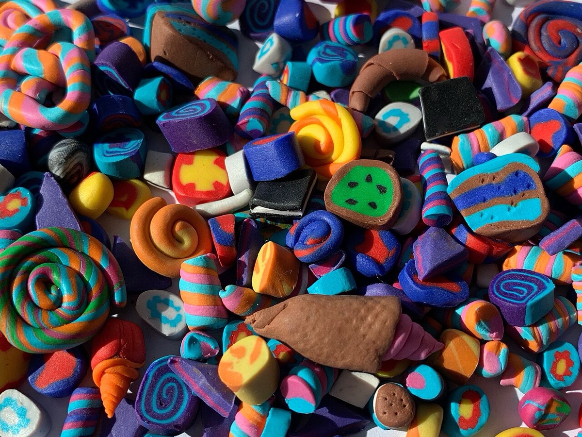 A colorful pile of Fimo polymer-clay miniatures, beads, and millefiori canes