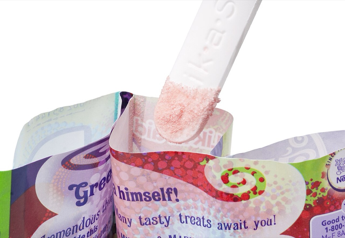 A Fun Dip Lik-A-Stix dipped into pink candy powder in an open pouch