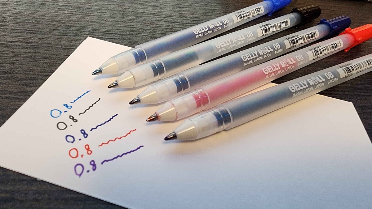 A row of Sakura Gelly Roll gel pens on paper with ink swatches