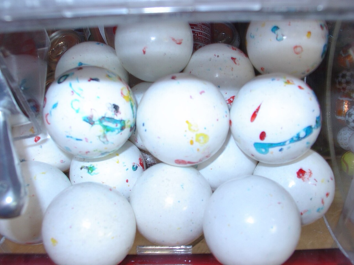 A bin full of large speckled, marbled giant jawbreaker candies