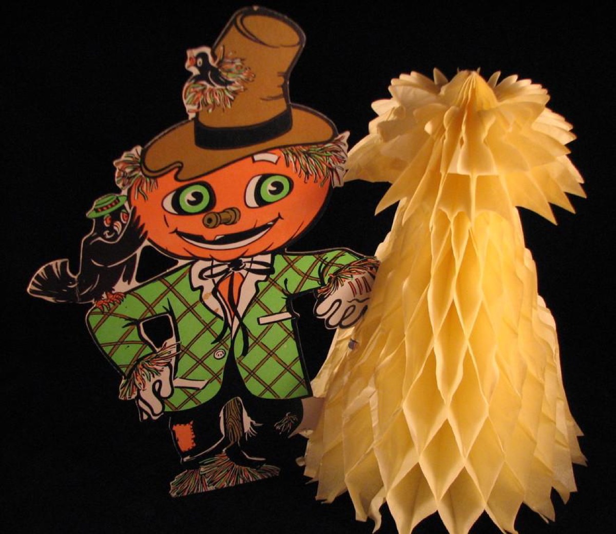 Vintage die-cut paper Halloween decorations — the kind taped up on classroom walls every October