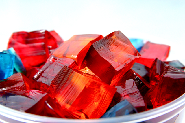 A bowl of red and blue cubes of firm gelatin, the Jigglers style of Jell-O you can pick up