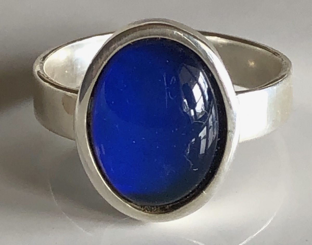 An original 1970s sterling-silver Mood Stone ring with its color-changing stone
