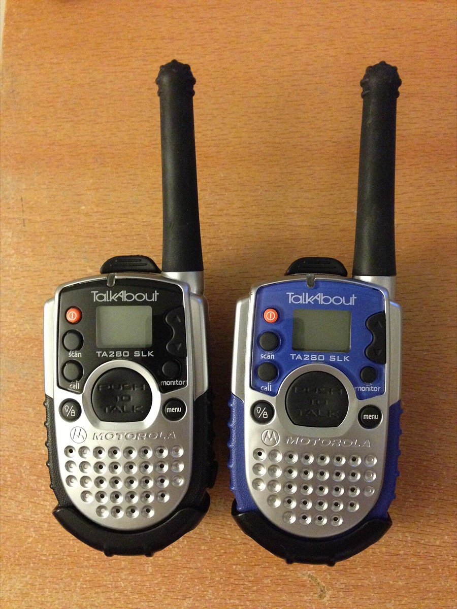 A pair of Motorola TalkAbout TA280 SLK walkie-talkies, one black and one blue