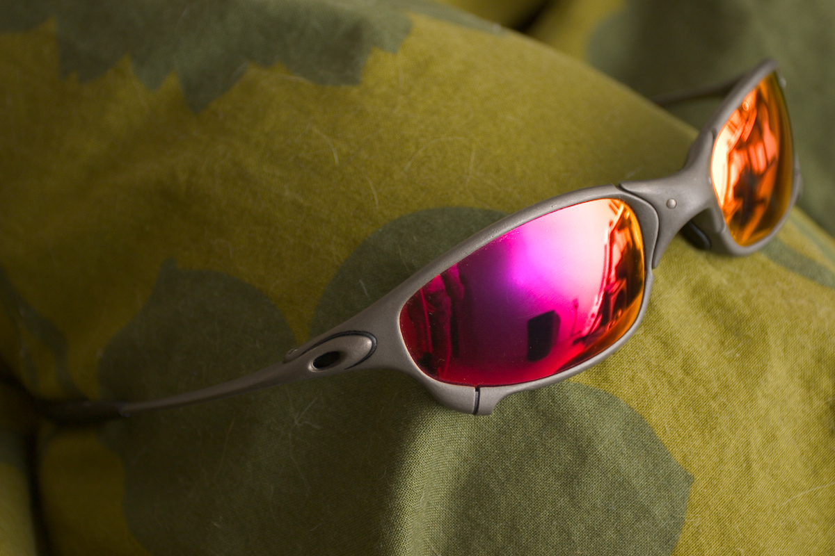 A pair of Oakley X-Metal Juliet sunglasses with mirrored red iridium lenses