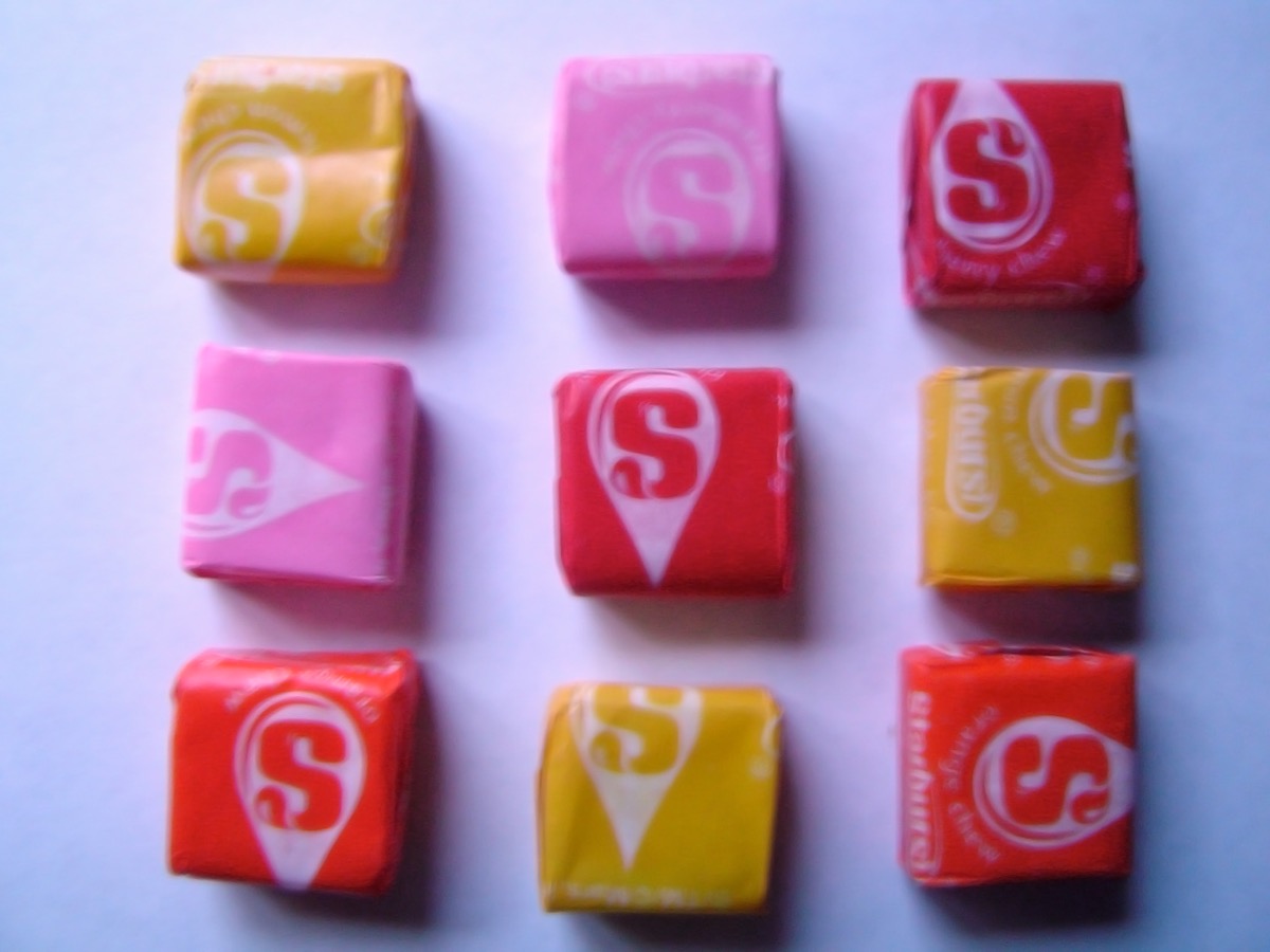 Nine wrapped Starburst squares in yellow, pink, red, and orange