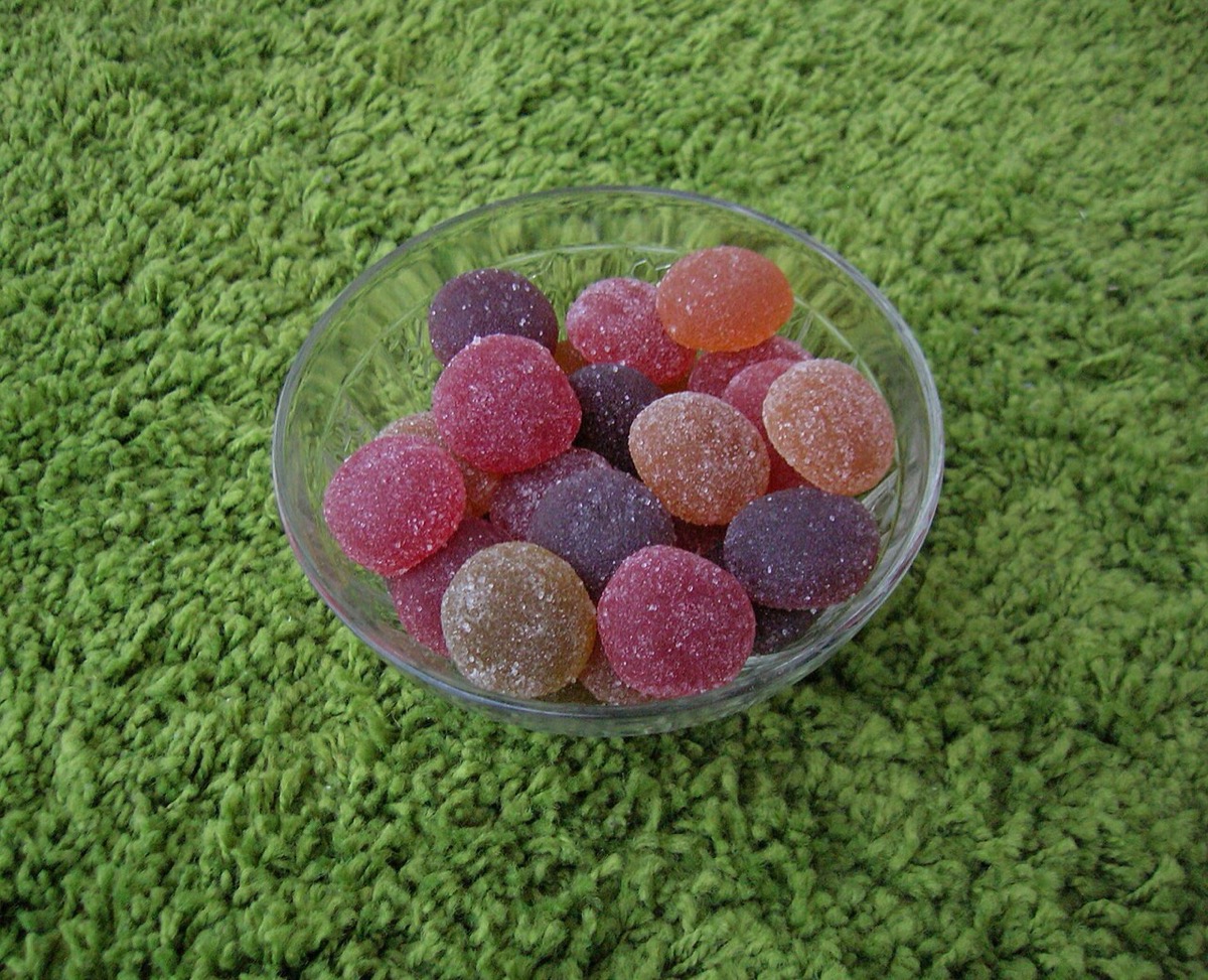 A glass dish of sugar-dusted fruit jelly candies, the Fruit Gems style of confection