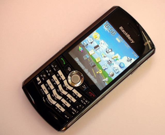 A black BlackBerry Pearl 8100 showing its trackball and hybrid keypad, 2006