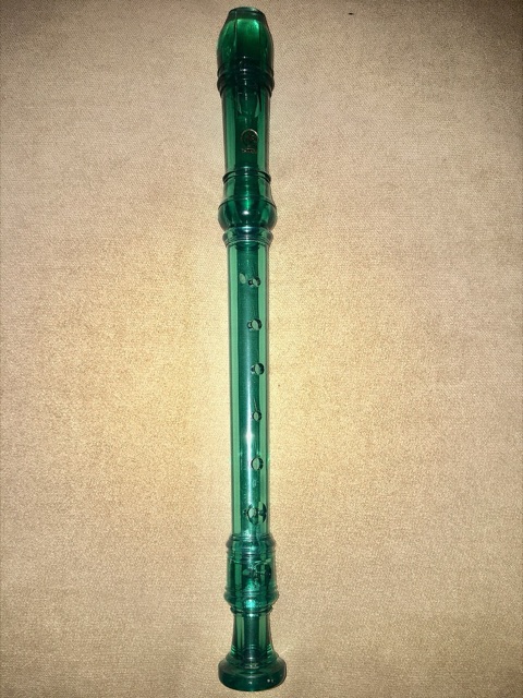 A translucent green Yamaha plastic soprano recorder — the standard school music-class model