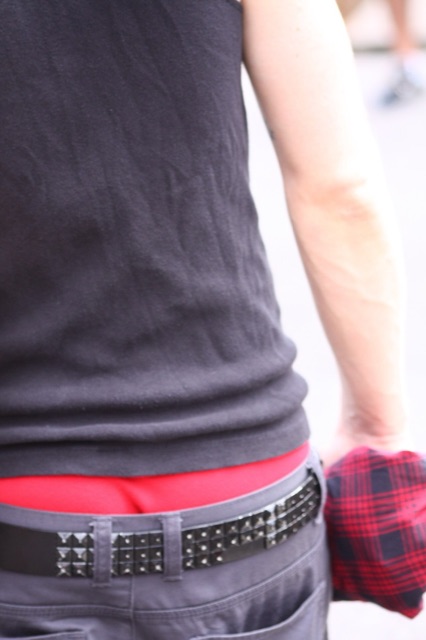 A man photographed from behind in New York in 2009, his grey trousers and studded belt sagging below red boxer shorts