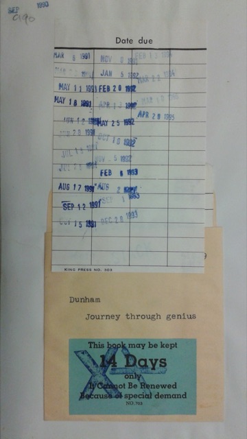A library book's date-due slip stamped with due dates from 1990 to 1995, above the manila card pocket in the back cover