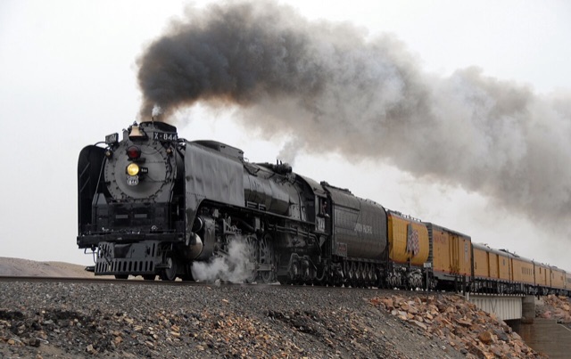 Union Pacific steam locomotive 844 under a plume of smoke, the engine seen in Shining Time Station's opening credits