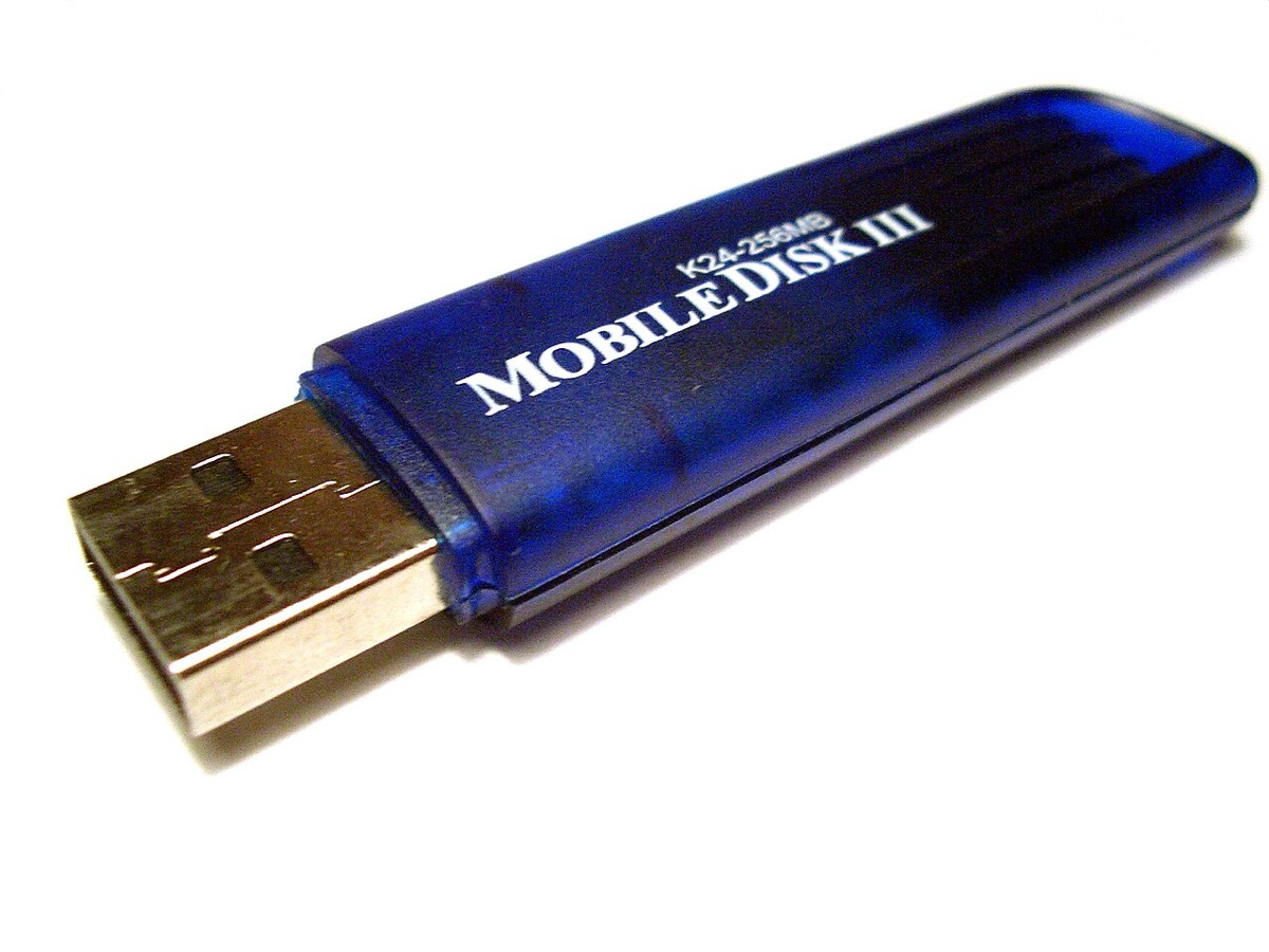 A translucent blue TwinMOS 256 MB USB flash drive, a typical early-2000s model